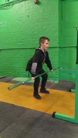 Pride Performance Youth Member practicing his olympic lifting